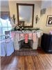 Fireplace with baby outfits hanging