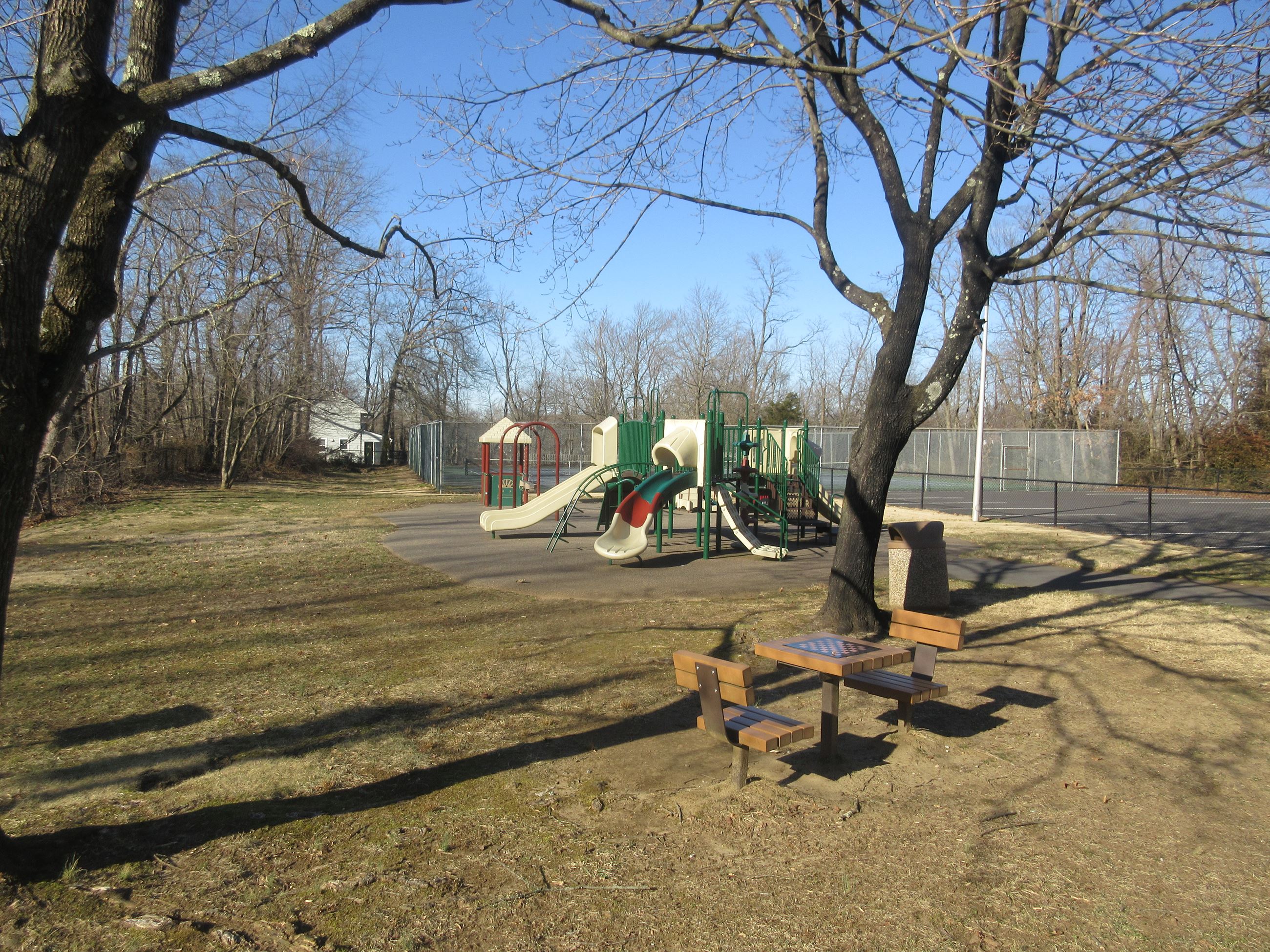 Interior view of the activity center, chess table, and tennis courts at the Dwier Center.