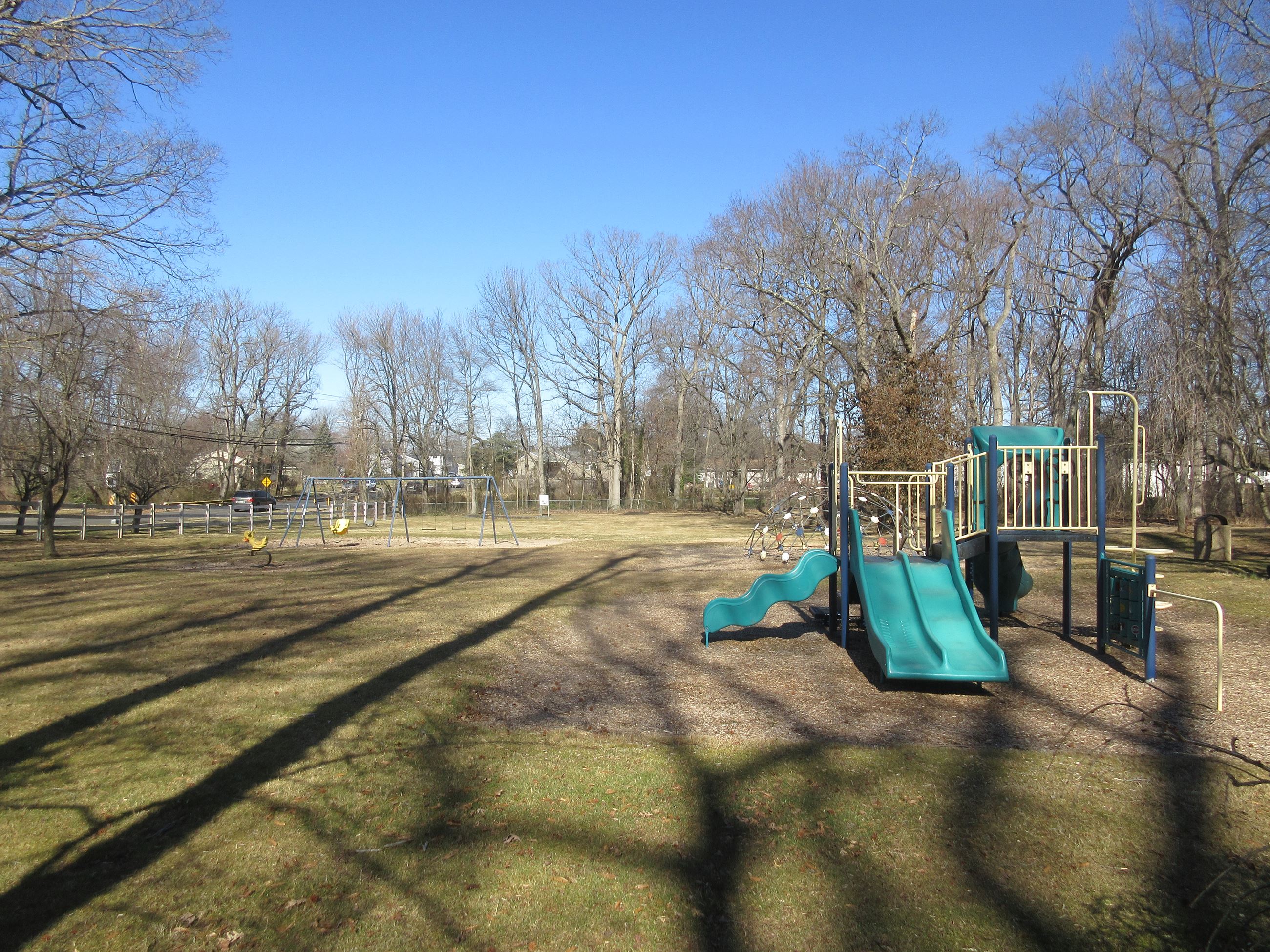 View of the activity centers, swings, and rain garden within George Dye Park.