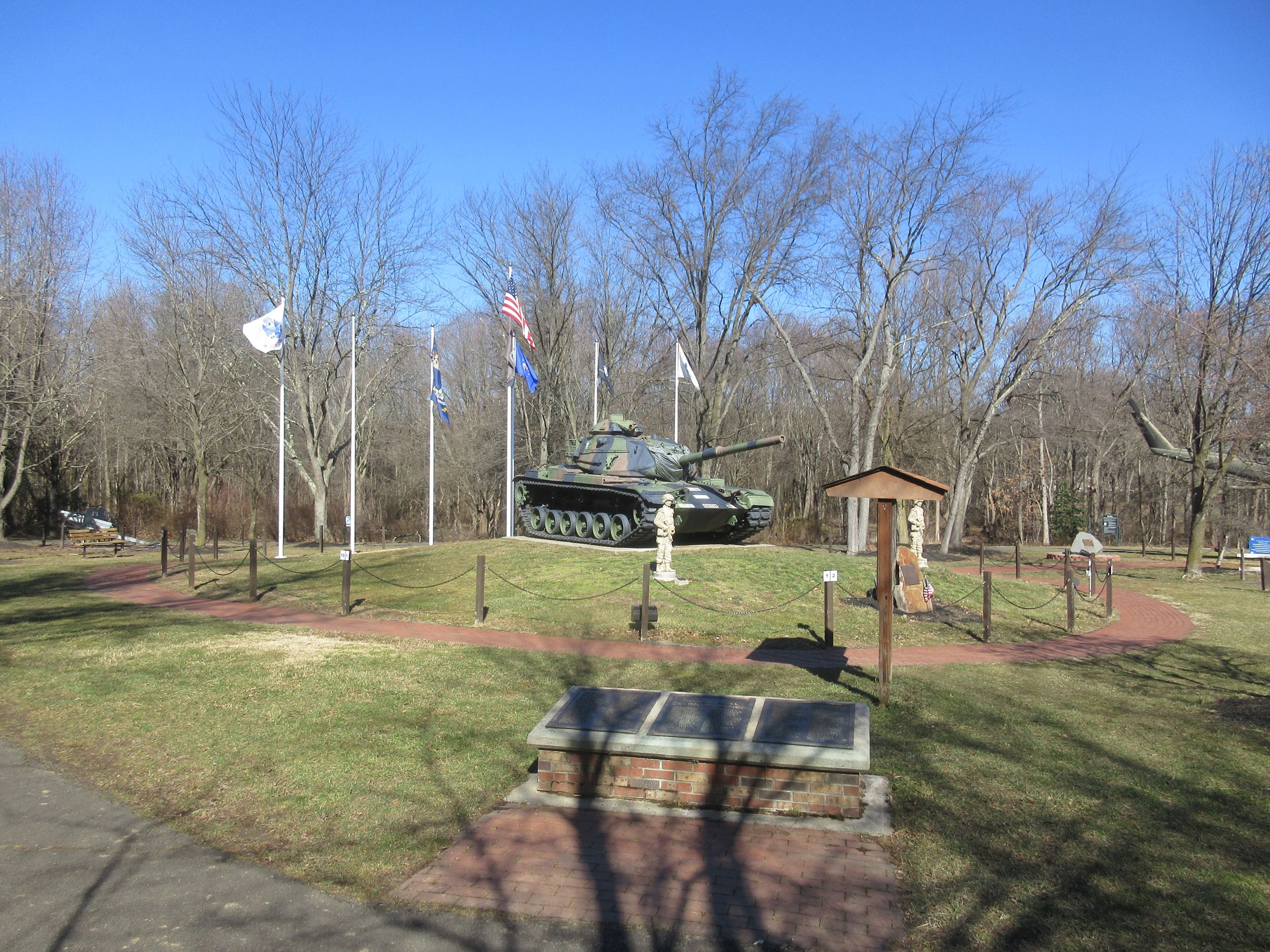 View of the tank and the patriotic brick walkway at the East Entrance.