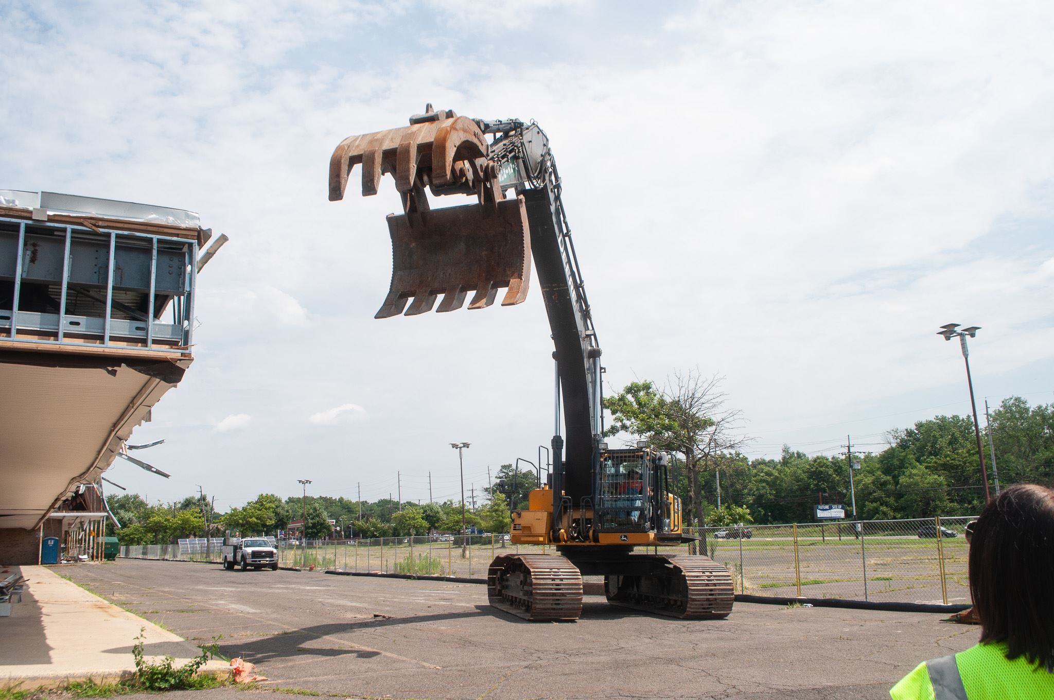 Construction equipment reaching for building