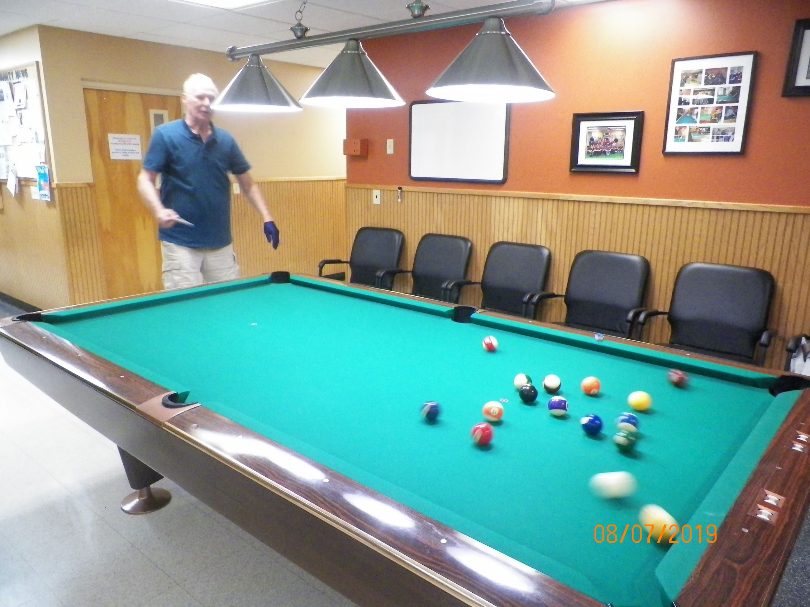 Senior Playing Billiards