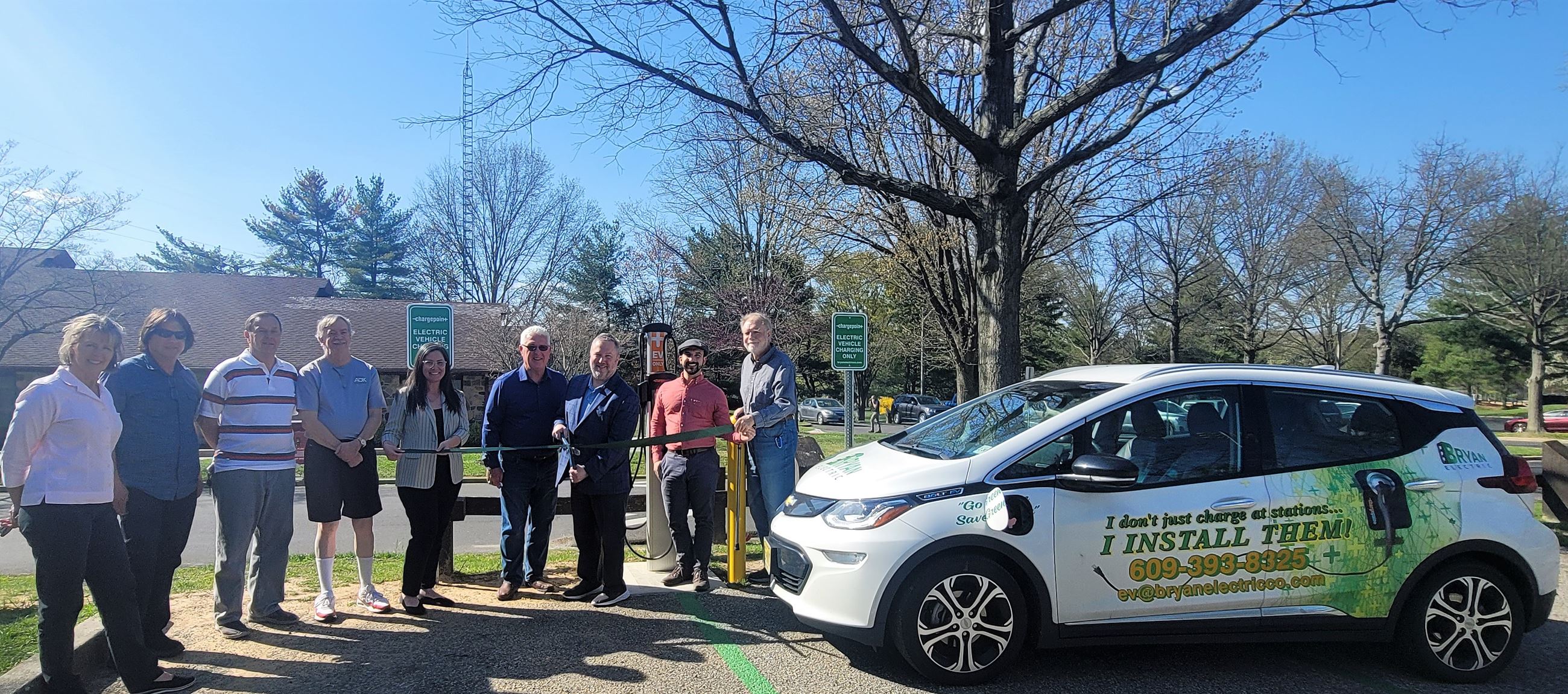 Group gathers to unveil electric vehicle charging station
