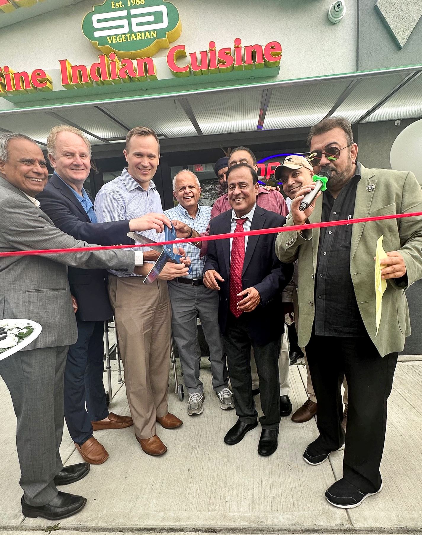 Officials and Business owners at the Swagath Gourmet grand opening ceremony