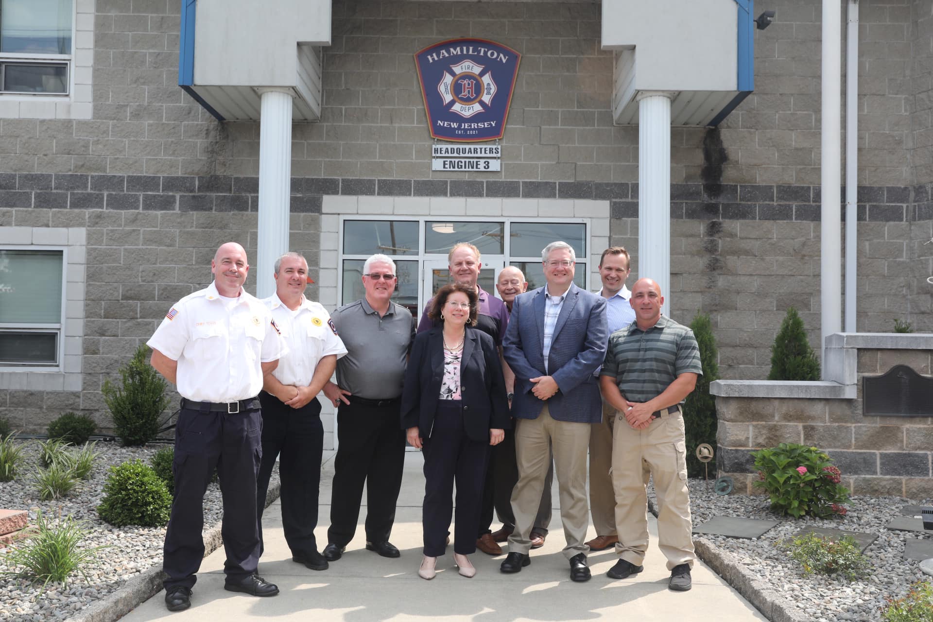 Mayor Martin, State Legislators, and Fire leadership out front of Fire HQ