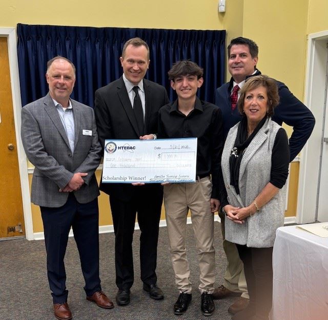Group photo of HTEDAC members and Mayor Martin with a high school scholarship winner.