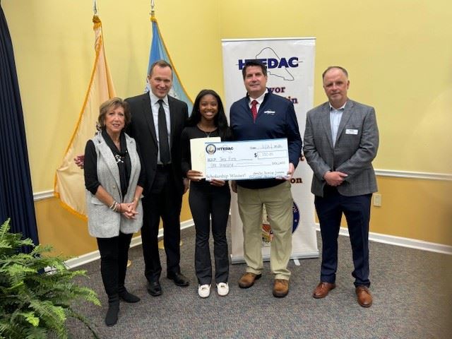 Group photo of HTEDAC members and Mayor Martin with a high school scholarship winner.