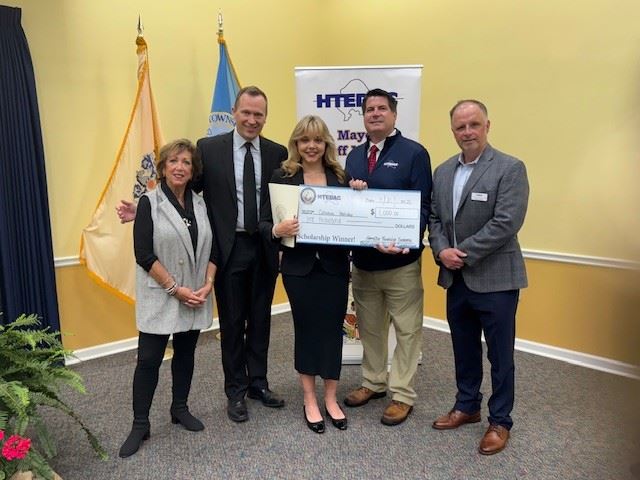Group photo of HTEDAC members and Mayor Martin with a high school scholarship winner.