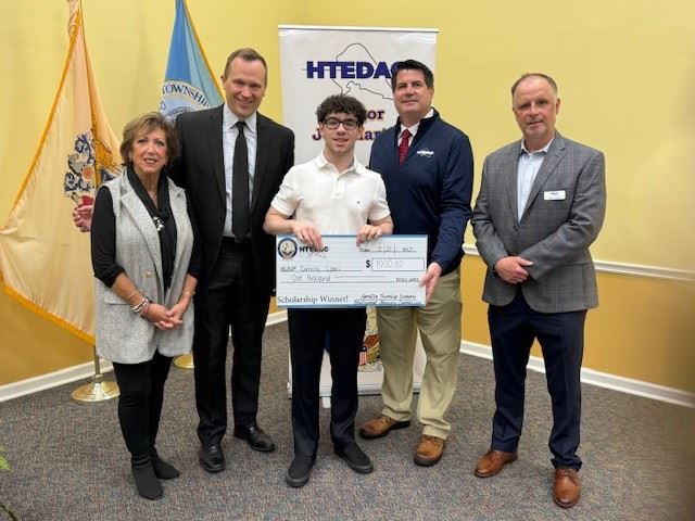 Group photo of HTEDAC members and Mayor Martin with a high school scholarship winner.