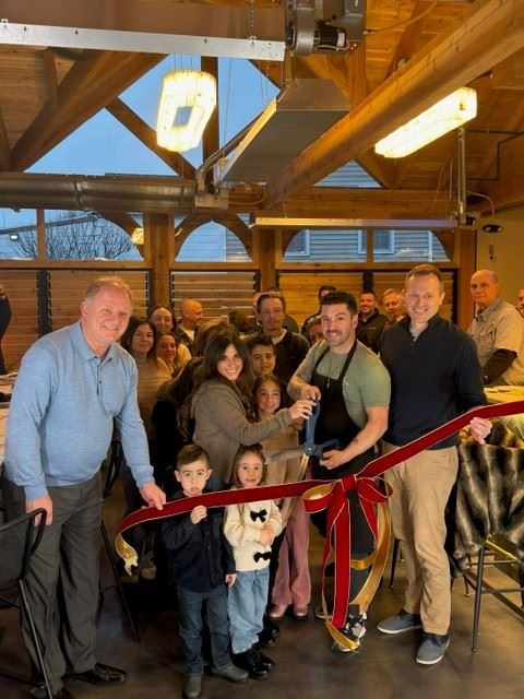Nottingham Tavern grand opening photo with group of people and mayor martin